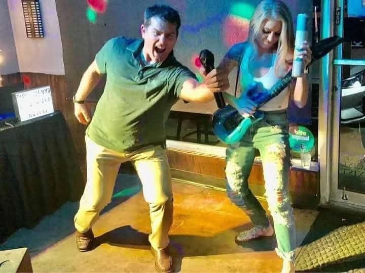 Guests enjoying an energetic karaoke performance