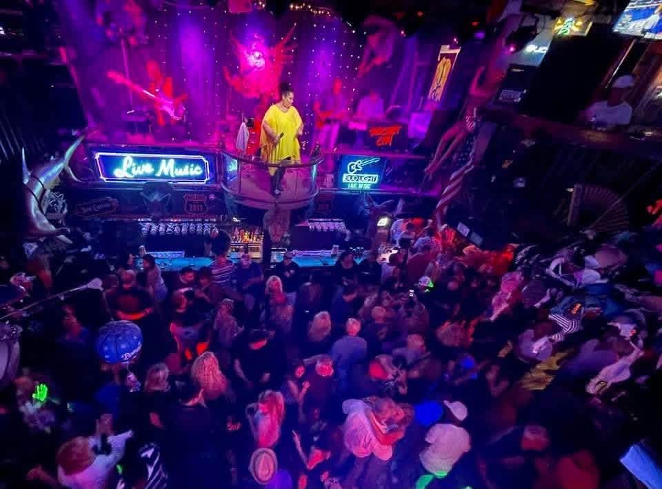 Live band performance in front of a lively crowd