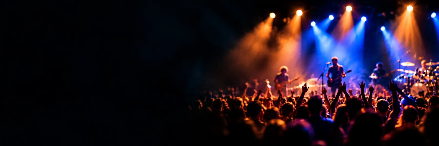 Live band performing under colorful stage lights